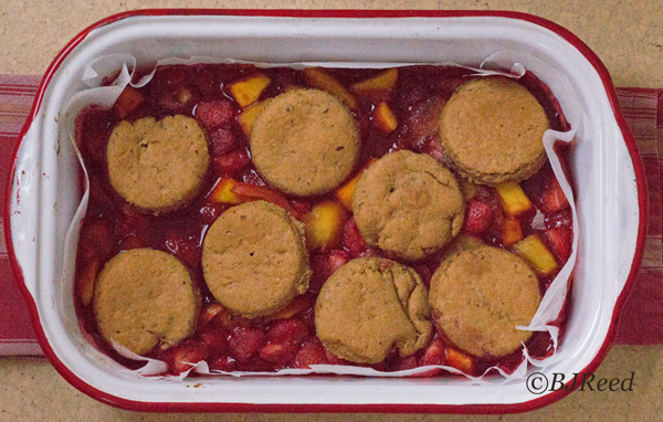 Coach BJ's Strawberries and peaches cobbler in the round