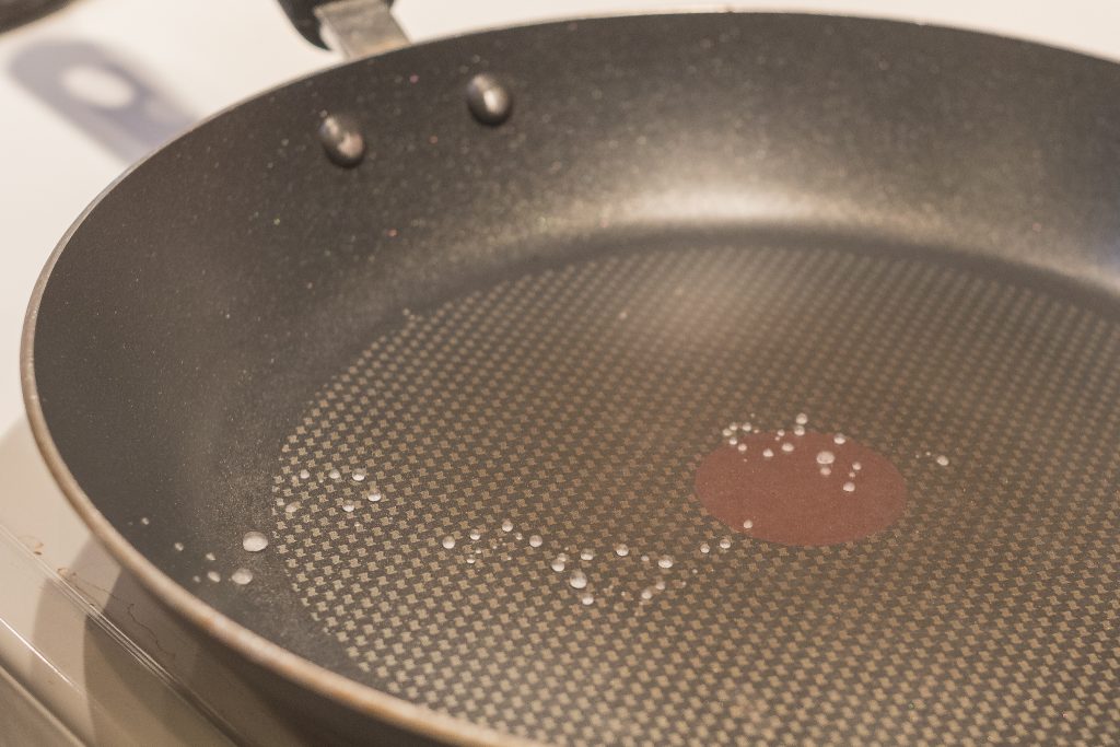 Pre-heat a non-stick skillet, no need for oil. Heat until drops of water bubble up on the skillet.